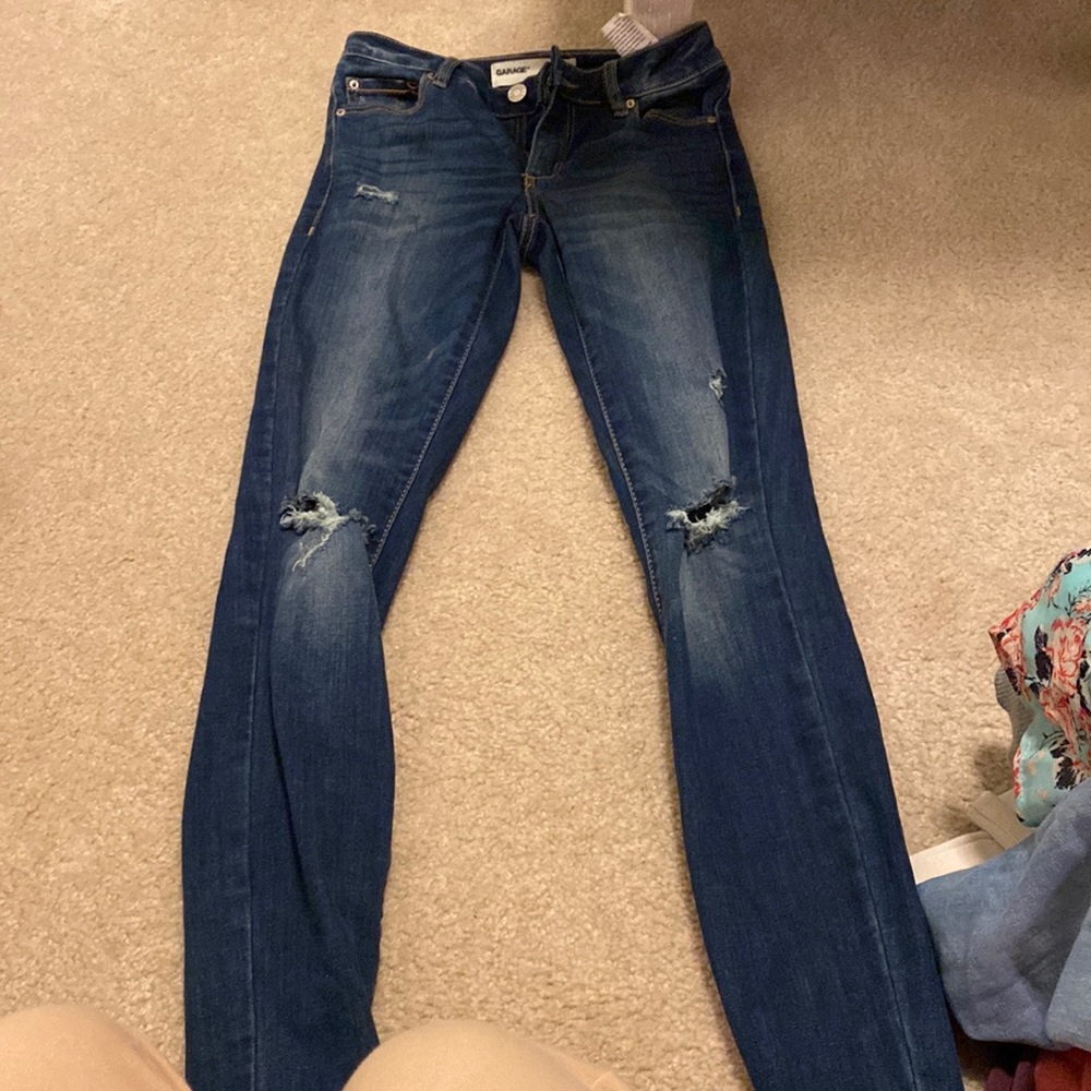 Garage dark wash skinny jeans distressed at knee